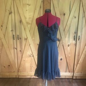 Polka dotted, ruffled, cross cross sundress